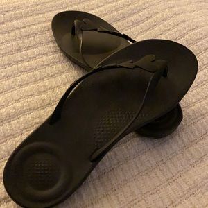 Black Fit Flop sandals with heart details